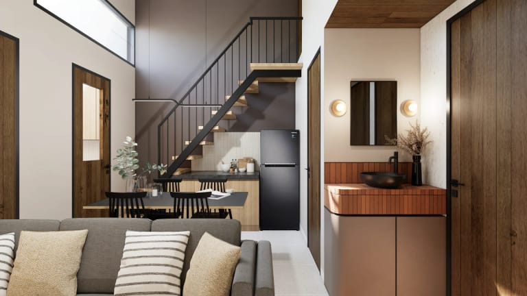 Ruang keluarga dan dapur Mula Sudimara — living room dengan tangga besi dan area pantry kulkas