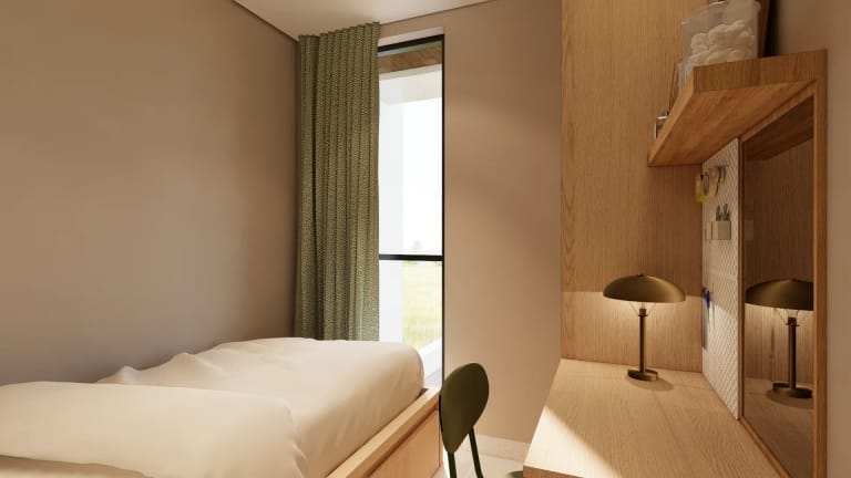 Kamar utama Mula Sudimara — master bedroom sage green dengan cermin oval dan dresser kayu